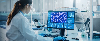 Scientist examining scientific data on computer screen